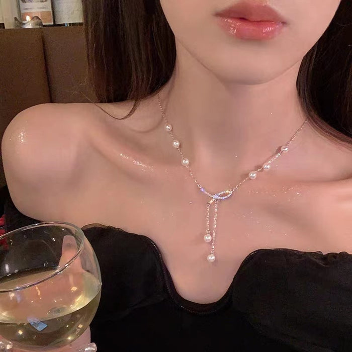 Wholesale Titanium steel necklace bow pearl collarbone chain temperament versatile niche bead sweater chain