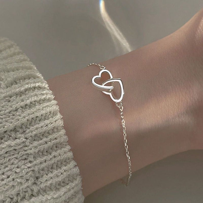 Wholesale Hollow out peach heart double heart-shaped bracelet, simple and niche style, lightweight and delicate heart-shaped bracelet