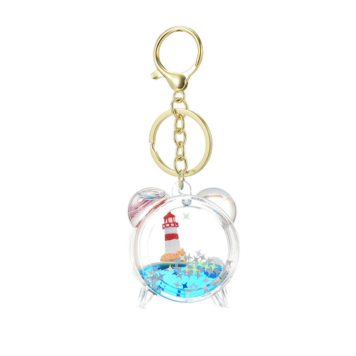 Wholesale Acrylic sailboat lighthouse blue oil-filled quicksand bottle keychain