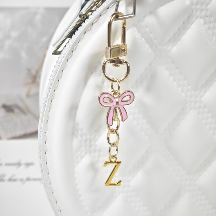 Wholesale Pink bow A-Z keychain alloy accessory