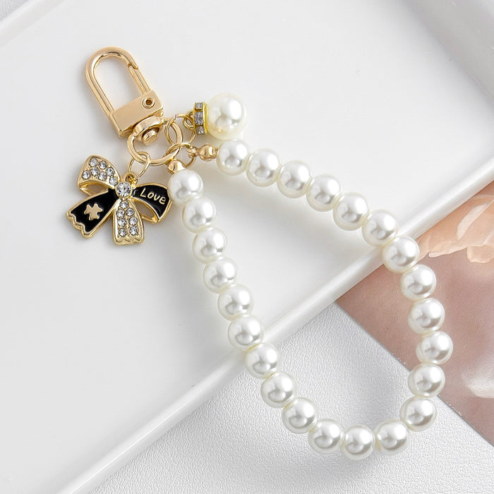 Wholesale Pearl chain beaded mobile phone lanyard bow pendant keychain