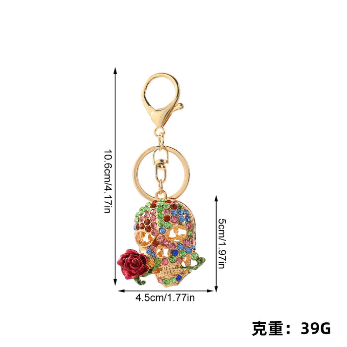Wholesale Trendy Rhinestone Skull Keychain with Zinc Alloy Bag Charm