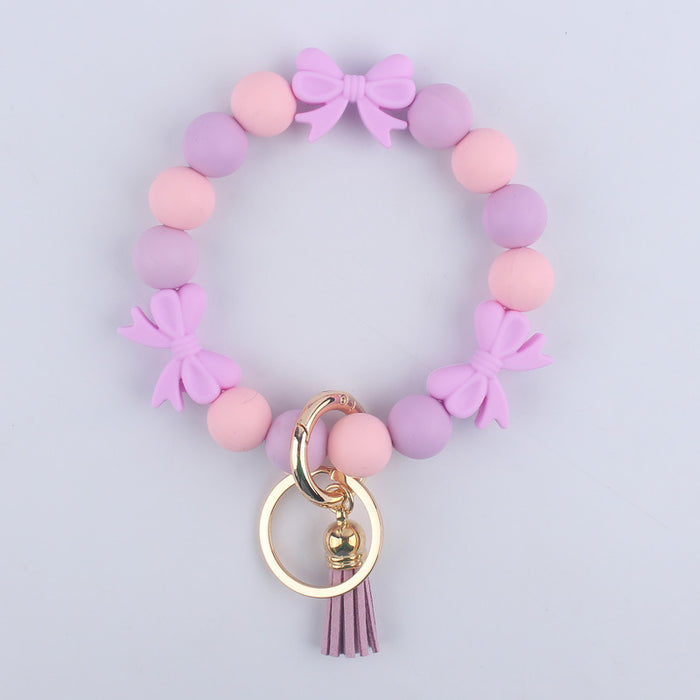 Wholesale PU Cartoon Bowknot Silicone Handmade Beaded Wrist Keychain JDC-KC-GuangTian006