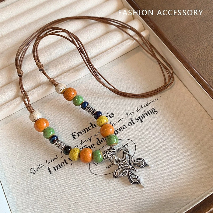 Wholesale Vintage feather necklace, double-layer layered long sweater chain accessory