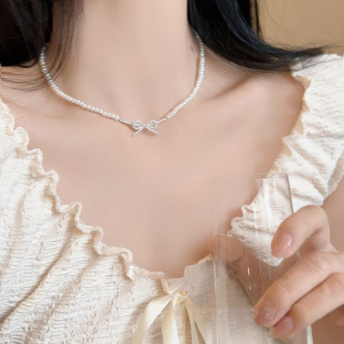 Wholesale Butterfly knot pearl necklace, simple and niche fashion, light luxury, versatile collarbone chain accessories