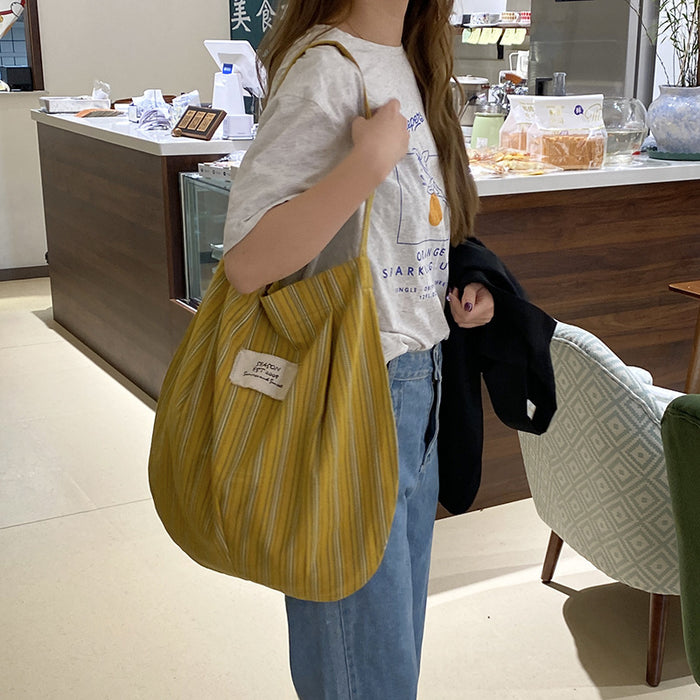 Wholesale Splicing striped canvas bag with simple temperament and large capacity commuting shoulder bag