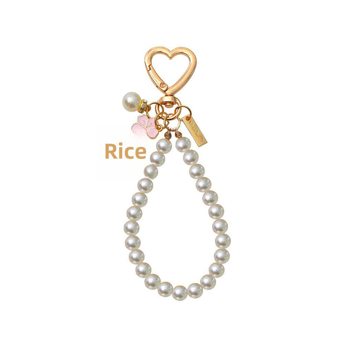 Wholesale Two tone flower alloy keychain pendant, cute letters, pearl accessories, headphone cover, bag, hanging decoration