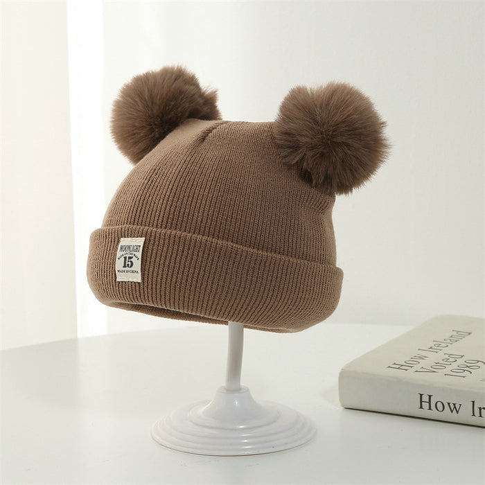 Wholesale Knitted hat with added yarn cap and fabric label