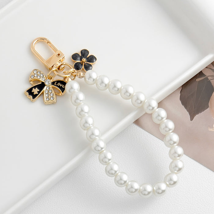 Wholesale Pearl chain beaded mobile phone lanyard bow pendant keychain