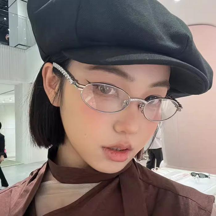 Wholesale Metallic silver small frame oval glasses with heart-shaped diamond inlay