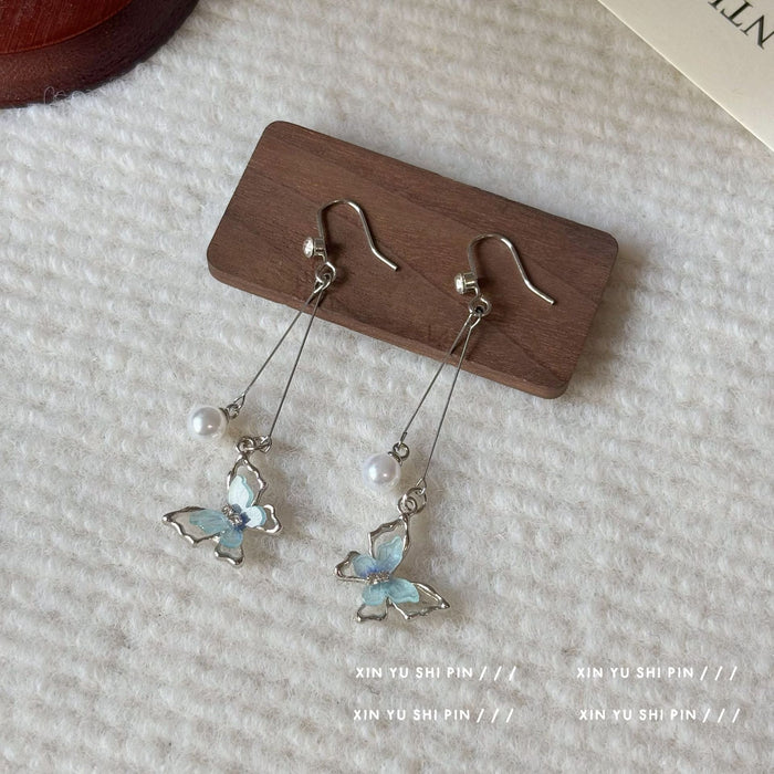 Wholesale Butterfly pearl tassel earrings with unique temperament, new earrings with distinctive features