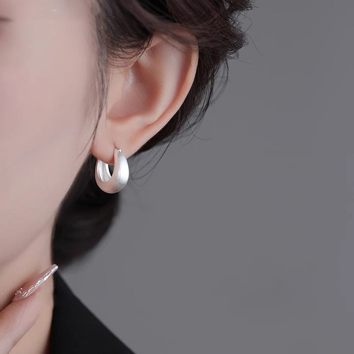 Wholesale Brushed silk ring earrings with temperament, ear buckles with a niche and high-end feel, silver needle earrings, and new earrings