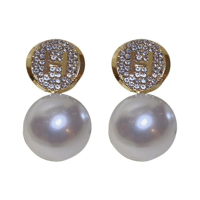 Wholesale Diamond studded pearl letter earrings are versatile, fashionable, niche, personalized, light luxury, high-end earrings
