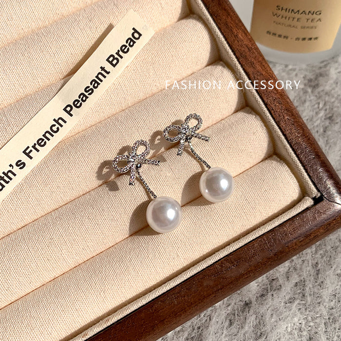 Wholesale Butterfly knot imitation pearl tassel earrings, light luxury temperament, earrings, earrings, studs, earrings
