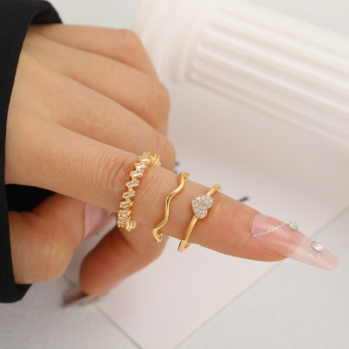 Wholesale Set of open-faced diamond-encrusted heart-shaped rings.
