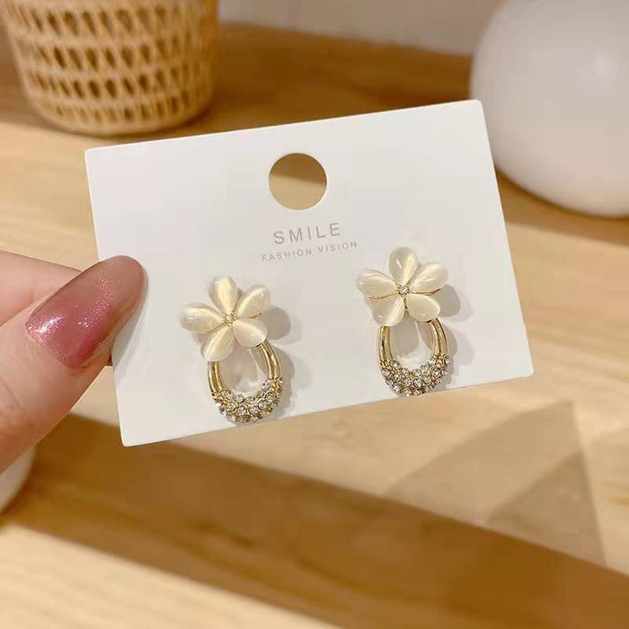 Wholesale Exquisite and compact diamond studded earrings with gentle temperament, flower cat eye stone earrings, high-end earrings wholesale