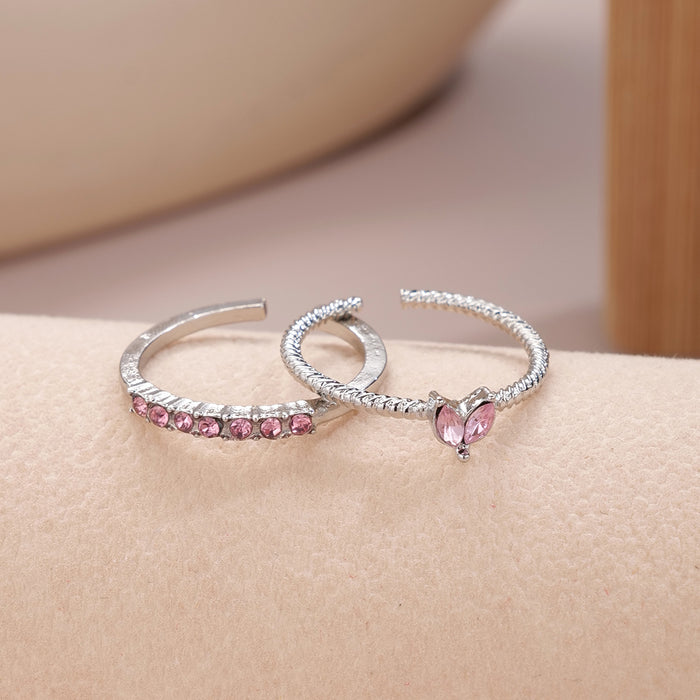 Wholesale Set of open-faced diamond-encrusted heart-shaped rings.
