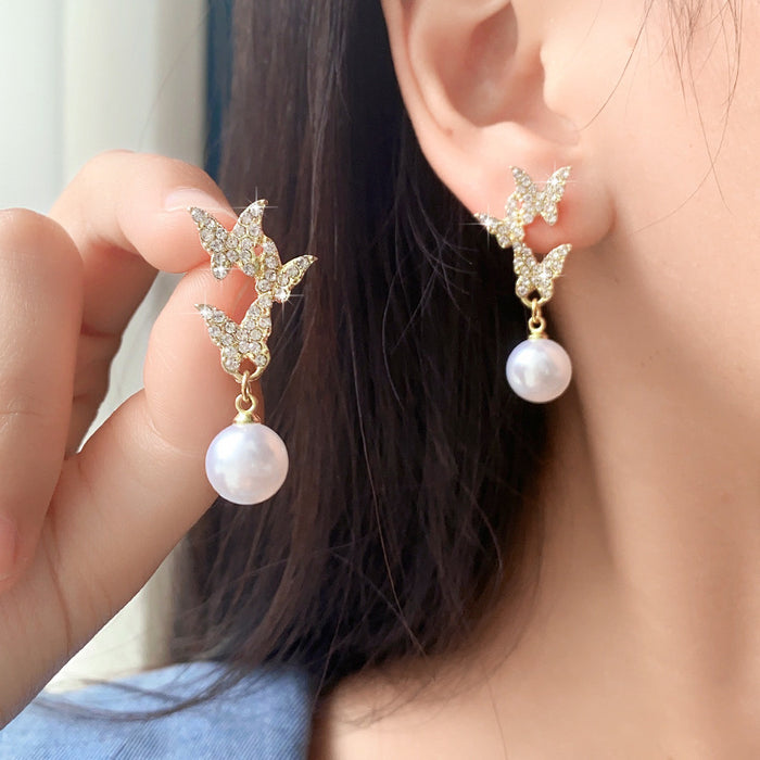 Wholesale New butterfly studded diamond earrings with temperament, long style, high-end feel, light luxury, fashionable and atmospheric pearl earrings