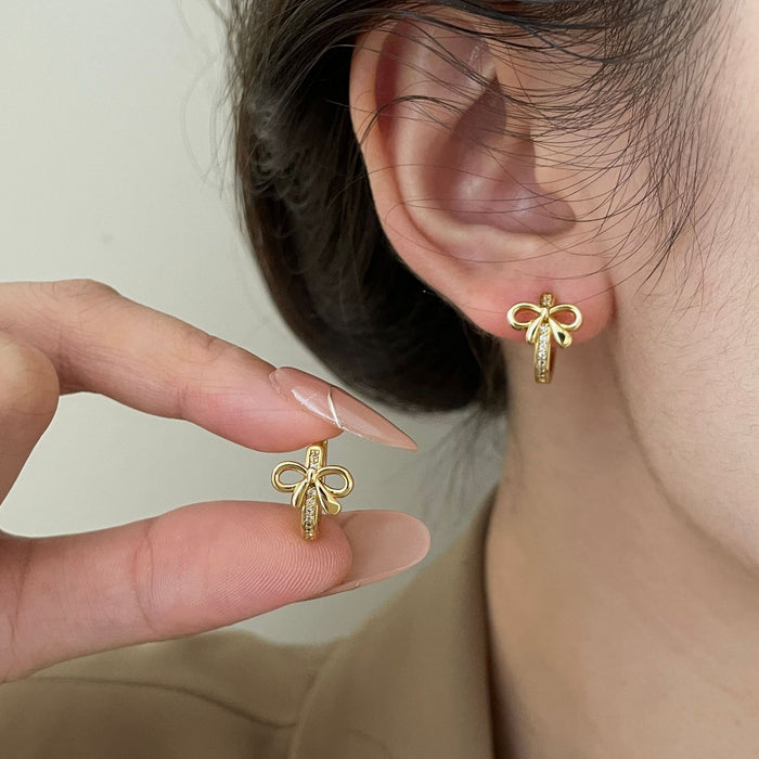 Wholesale Zircon delicate metal bow earrings