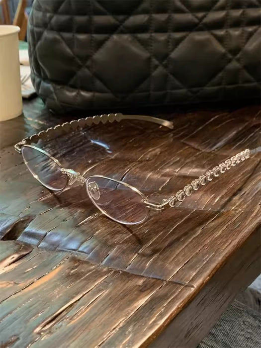 Wholesale Metallic silver small frame oval glasses with heart-shaped diamond inlay
