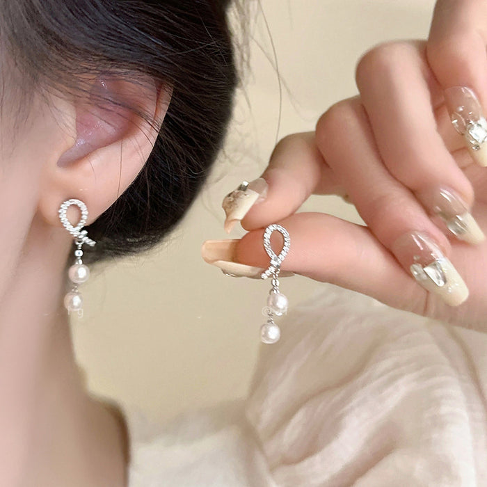 Wholesale Pearl zircon bow tassel silver needle earrings with high-end feel, new temperament earrings