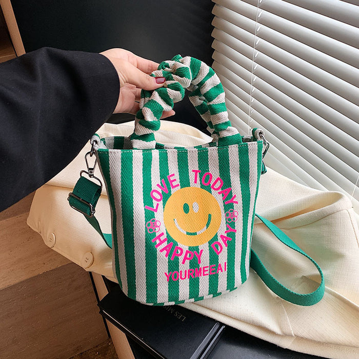 Wholesale Canvas bag, cute smiling face handbag, striped crossbody bag, commuting shoulder bag