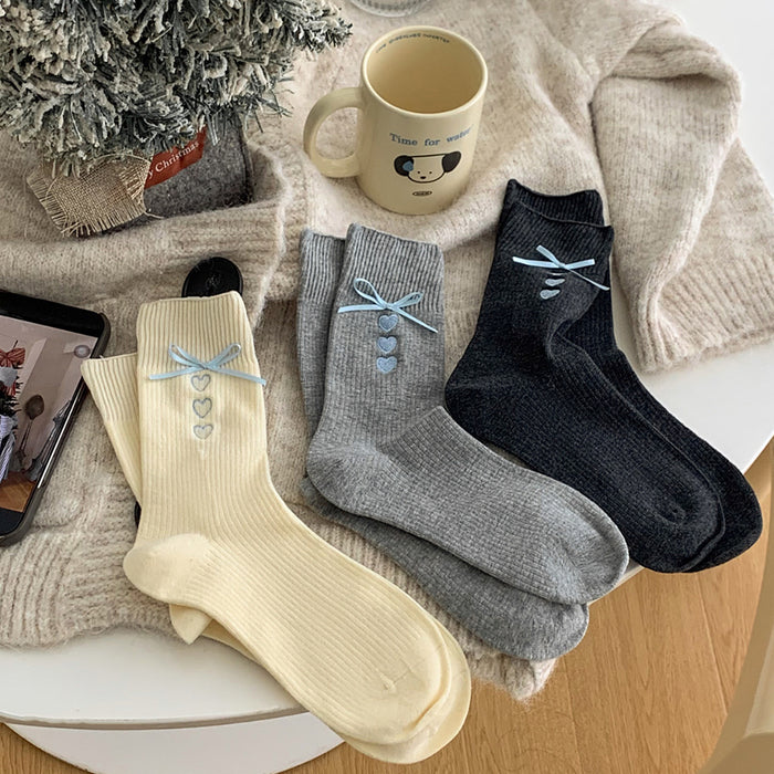 Wholesale Embroidered heart-shaped tube socks with blue ribbon and bow, stacked socks