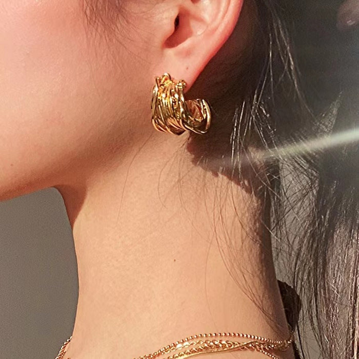Wholesale Vintage-style wire-wrapped C-shaped hoop earrings in 18K gold.