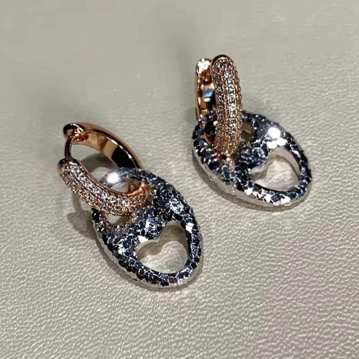 Wholesale 24K gold electroplated pig nose earrings with strong color retention,  luxurious and high-end feel,  CNC-machined delicate round two-tone earrings.