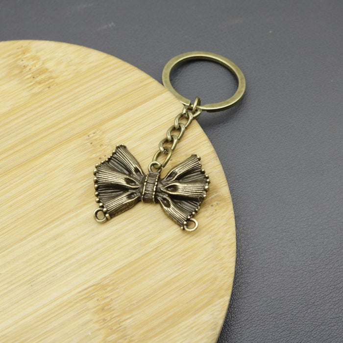 Wholesale Iron Alloy Simple Bow Keychain JDC-KC-HEMS003