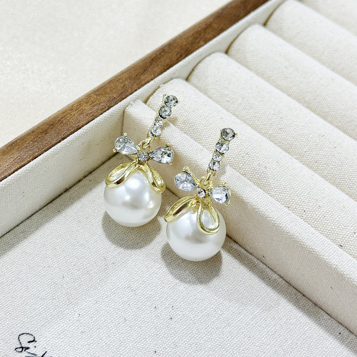 Wholesale Butterfly knot pearl pendant earrings, niche fashion, versatile design, knotted earrings