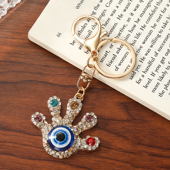 Wholesale Turkish Evil Eye Palm Keychain Zinc Alloy White Bag Charm Resale