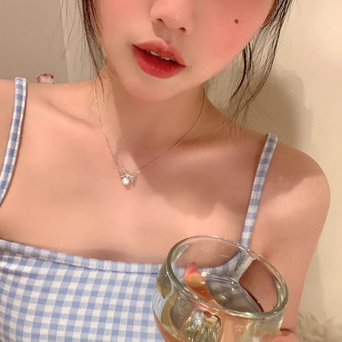 Wholesale Titanium steel pearl bow necklace, new high-end, light luxury collarbone chain accessory