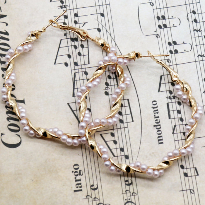 Wholesale Simple and stylish earrings with alloy pearl circle earrings