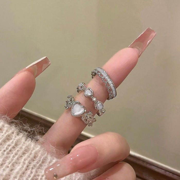 Wholesale Set of open-faced diamond-encrusted heart-shaped rings.