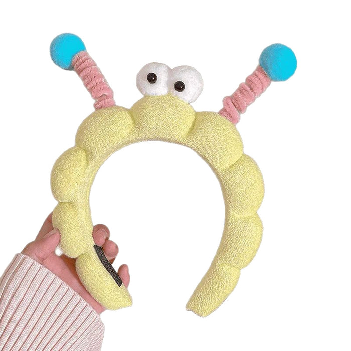 Wholesale Cute girl' s twistable hairband with big-eyed plush toy design.