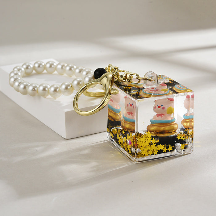 Wholesale Oil-Filled Black Gold Quicksand Piggy Liquid Keychain