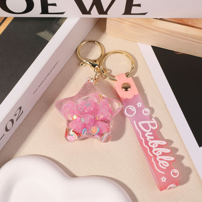 Wholesale five-pointed star flower quicksand bottle creative colorful cartoon bag key chain jewelry small pendant ornaments color