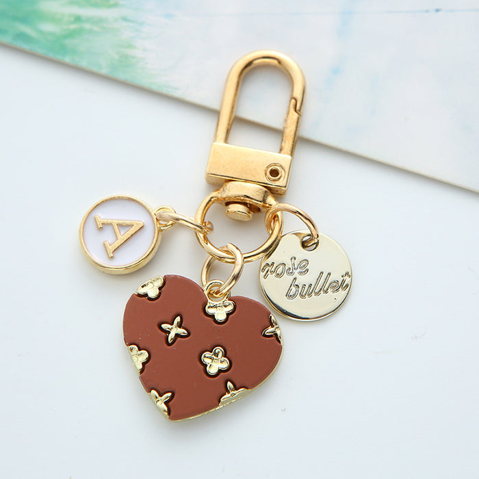 Wholesale alloy love keychain pendant hollow small flower letter round card accessories