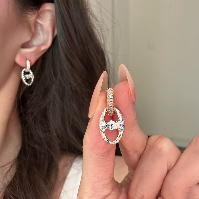 Wholesale 24K gold electroplated pig nose earrings with strong color retention,  luxurious and high-end feel,  CNC-machined delicate round two-tone earrings.