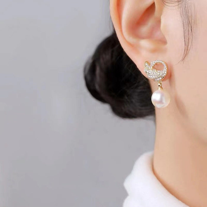 Wholesale Exquisite and elegant diamond studded pearl earrings, high-end and luxurious commuting versatile earrings, stylish and elegant style
