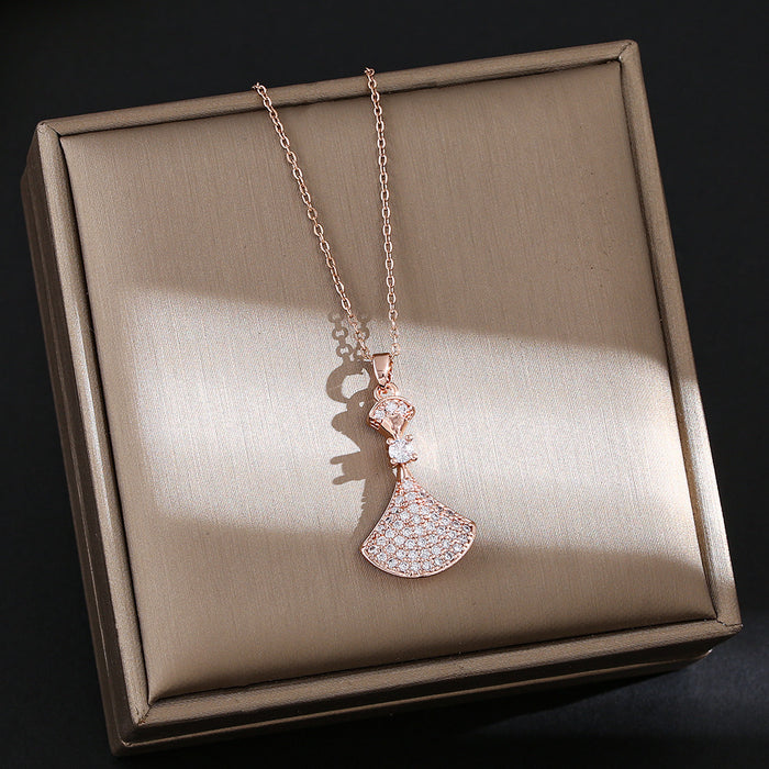 Wholesale Titanium steel necklace with a small dress pendant encrusted with rhinestones.