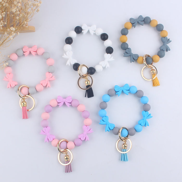 Wholesale PU Cartoon Bowknot Silicone Handmade Beaded Wrist Keychain JDC-KC-GuangTian006