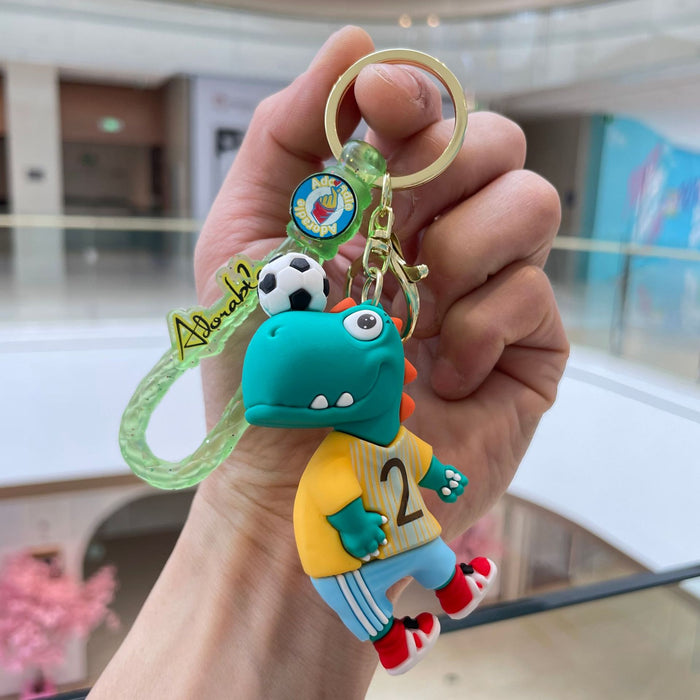 Wholesale Creative new football dinosaur keychain, exquisite and cute soft plastic figurine pendant, bag accessories, small gifts
