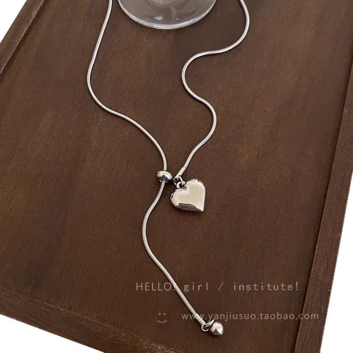 Wholesale Minimalist silver heart pendant necklace, women's light luxury high-end feel, long sweater chain accessory