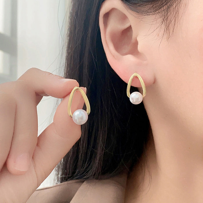 Wholesale Silver needle pearl earrings with simple and niche design, light luxury temperament, earring accessories