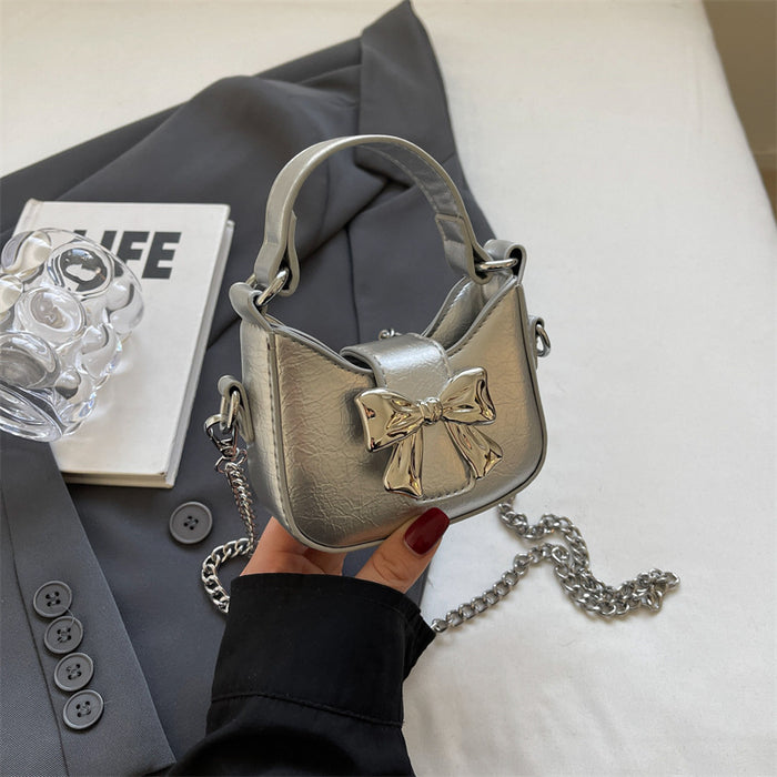 Wholesale New retro oil leather handbag with shiny bow and chain crossbody bag