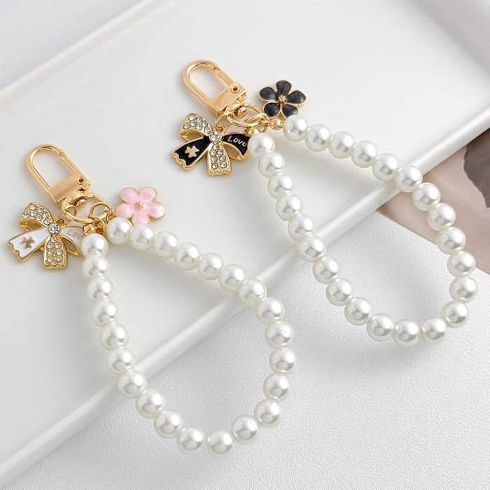 Wholesale Pearl chain beaded mobile phone lanyard bow pendant keychain