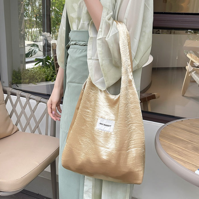 Wholesale Small niche design, environmentally friendly silver shoulder bag, large capacity leisure commuting shopping bag, handheld