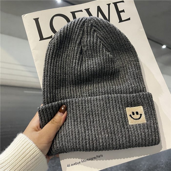 Wholesale Autumn and Winter Cute Smiley Face Logo Wool Knitted Hat JDC-FH-Yizhan002